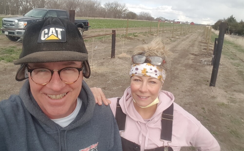 Jeff and his wife Karla smiling for a selfie while working in their Nebraska vineyard